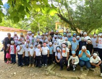 Group photo of students wearing bird masks.