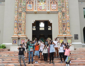 Group photo of birdwatchers in front of a building.